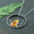 srebrny naszyjnik ażurowe koło z bursztynem